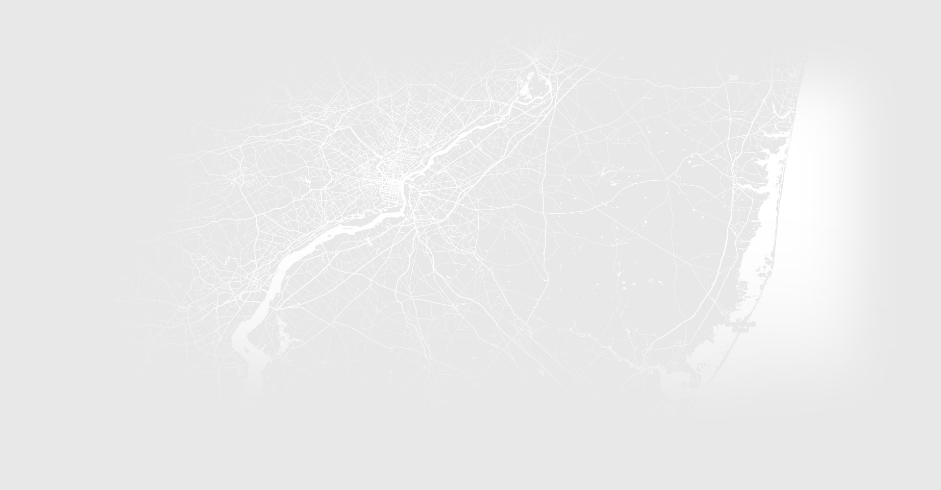 Subtle grayscale map of Conshohocken, Pennsylvania, used as a decorative background element.